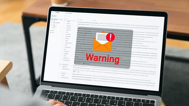 scam email warning on laptop